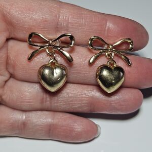 Gold Tone Bow With Dangling Heart Earrings